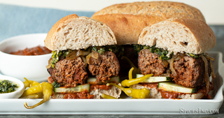 Merguez Sausage Sandwiches with Harissa Sauce and Mint Gremolata